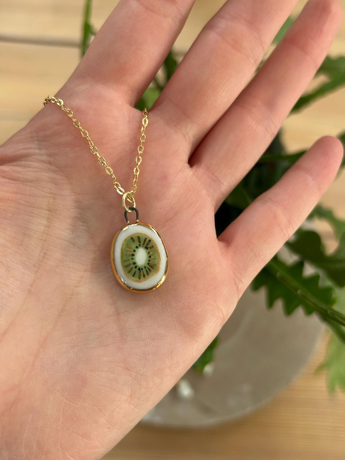 Hand-Sculpted Porcelain Kiwi Pendant: 24k Gold Lustre Ceramic Necklace Charm