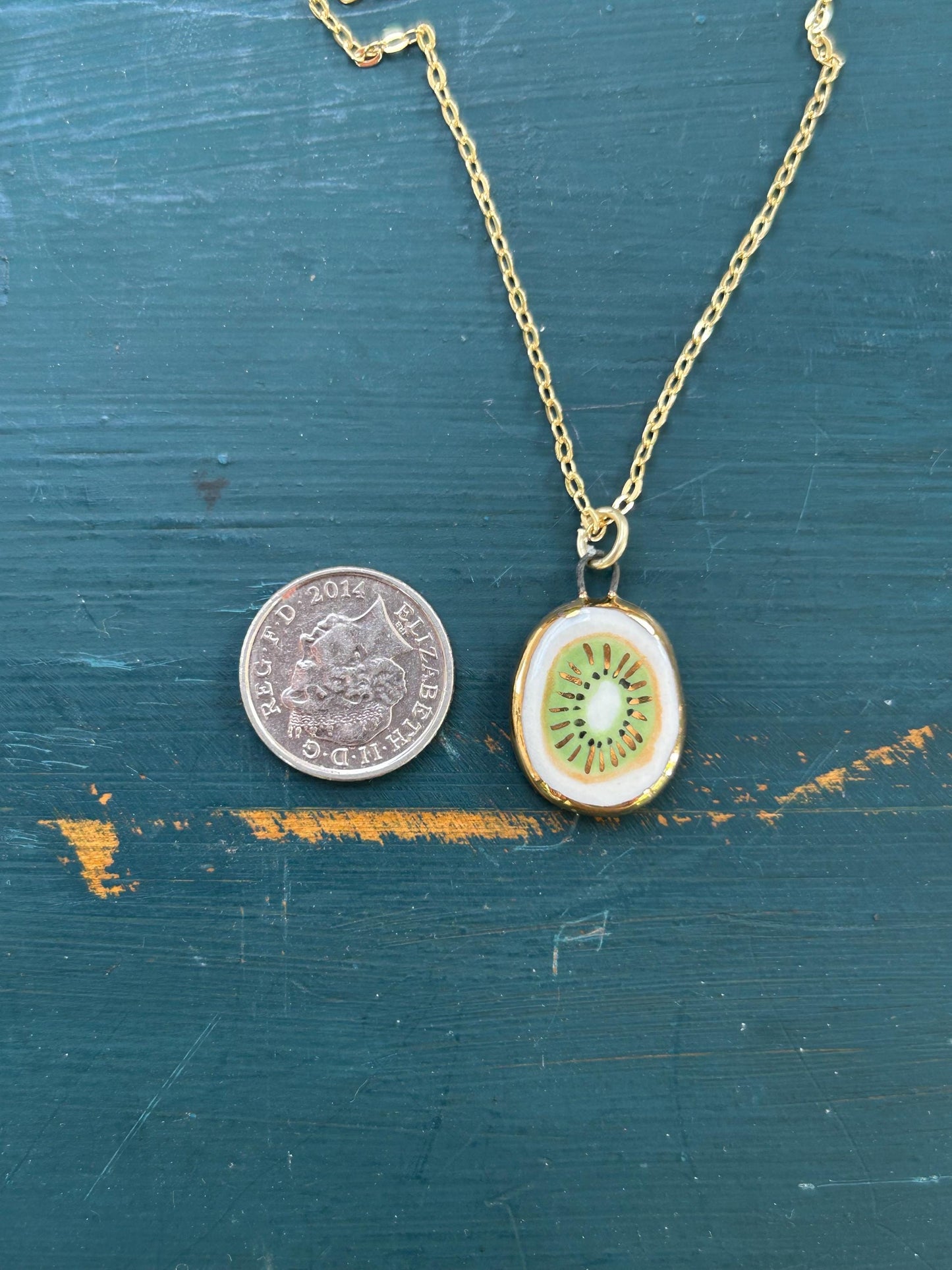 Hand-Sculpted Porcelain Kiwi Pendant: 24k Gold Lustre Ceramic Necklace Charm