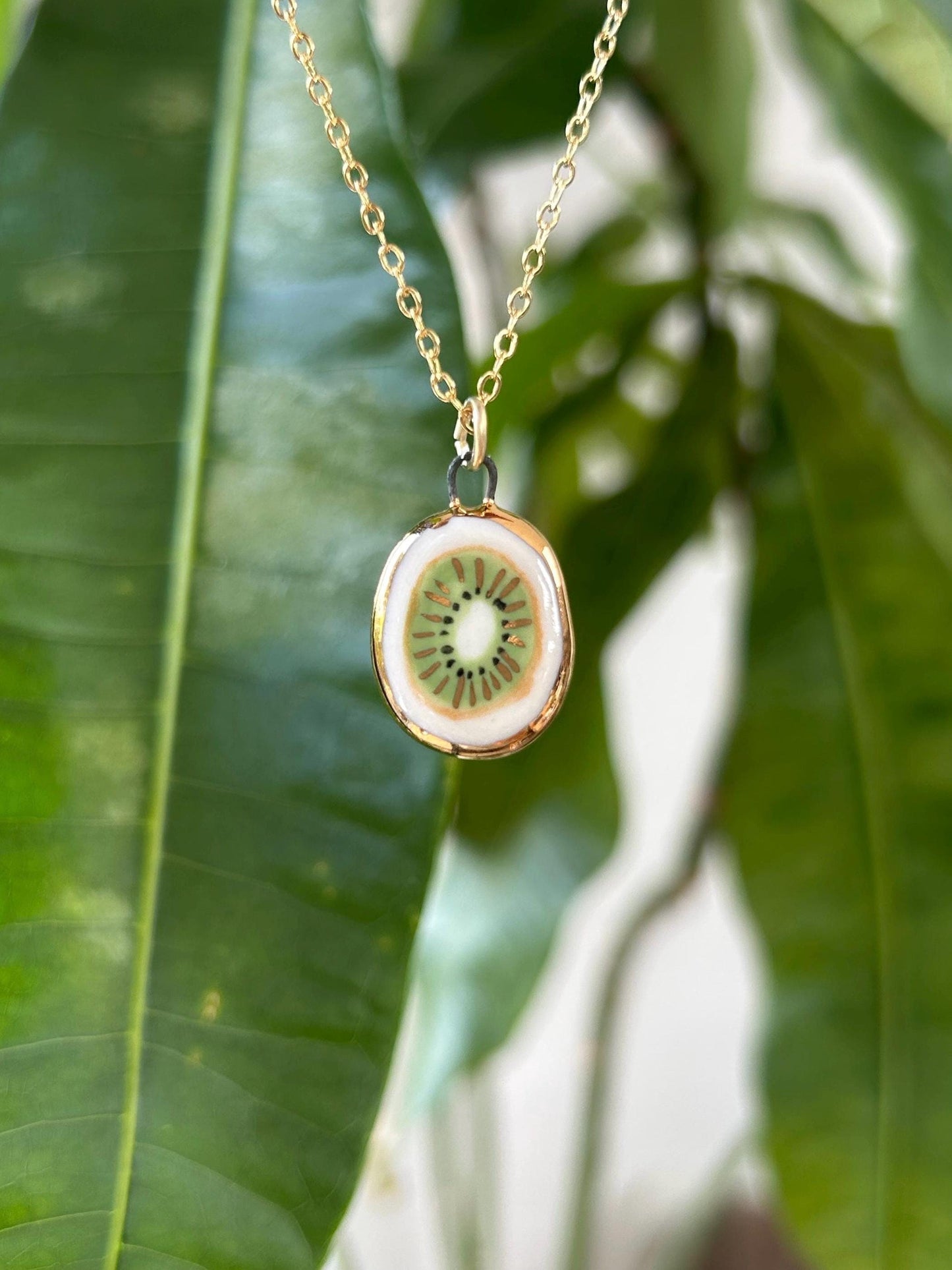 Hand-Sculpted Porcelain Kiwi Pendant: 24k Gold Lustre Ceramic Necklace Charm